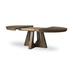 Sculptural angles define this expansive oak dining table, as angled cutouts play up a tapered base and top. Expandable design includes two leaves, easily extending from 77" to 94", for intimate gatherings and dinner parties alike Amethyst Home provides interior design, new home construction design consulting, vintage area rugs, and lighting in the San Diego metro area.