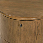Modern with hints of heritage and Art Deco, crafted of warm, spiced oak. A flexible layering piece that can be styled just about anywhere — as a nightstand or in the entryway or hallway, its slight scale and demilune shape are great for smaller spaces, as its flat back can be styled right up against the wall. Amethyst Home provides interior design, new home construction design consulting, vintage area rugs, and lighting in the Laguna Beach metro area.