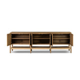 Simple yet refined, a Danish design-influenced sideboard is made from light-finished ash, with iron hardware finished in a sleek gunmetal. Perfect for larger spaces, with six doors and generous interior storage. Stretcher-style shelving made from woven paper cord serves up a textural finishing touch. Amethyst Home provides interior design, new home construction design consulting, vintage area rugs, and lighting in the Laguna Beach metro area.