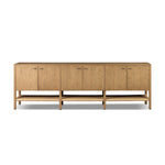 Simple yet refined, a Danish design-influenced sideboard is made from light-finished ash, with iron hardware finished in a sleek gunmetal. Perfect for larger spaces, with six doors and generous interior storage. Stretcher-style shelving made from woven paper cord serves up a textural finishing touch. Amethyst Home provides interior design, new home construction design consulting, vintage area rugs, and lighting in the Salt Lake City metro area.