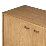 Simple yet refined, a Danish design-influenced sideboard is made from light-finished ash, with iron hardware finished in a sleek gunmetal. Perfect for larger spaces, with six doors and generous interior storage. Stretcher-style shelving made from woven paper cord serves up a textural finishing touch. Amethyst Home provides interior design, new home construction design consulting, vintage area rugs, and lighting in the San Diego metro area.