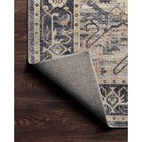 Featuring soft motifs in a carefully curated color palate of black, blue, yellow, and hints of orange, the Hathaway Navy / Multi area rug captures the essence of one-of-a-kind vintage or antique area rug. This rug is ideal for high traffic areas such as living rooms, dining rooms, kitchens, hallways, and entryways.