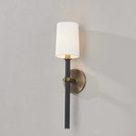 A traditional design with modern detailing, Belvedere is defined by its uniquely held candlesticks. Each Patina Brass arm on the ten-light chandelier holds two Texture Black candlesticks pierced through on opposing sides of the arm. The candlestick on the one-light wall sconce is pinched in place by two Patina Brass arms. Amethyst Home provides interior design, new home construction design consulting, vintage area rugs, and lighting in the Boston metro area.