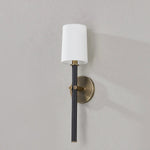 A traditional design with modern detailing, Belvedere is defined by its uniquely held candlesticks. Each Patina Brass arm on the ten-light chandelier holds two Texture Black candlesticks pierced through on opposing sides of the arm. The candlestick on the one-light wall sconce is pinched in place by two Patina Brass arms. Amethyst Home provides interior design, new home construction design consulting, vintage area rugs, and lighting in the Winter Garden metro area.
