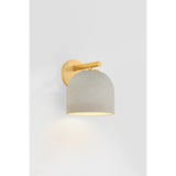 Inspired by Neoclassical architecture, Cara uses a domed shade and textural ceramic finish for a sconce that feels both ancient and new. A matte reactive glaze in an creamy hue creates a subtle surface grain that imitates natural stone. A circular modern armback in an Aged Brass finish adds shine to the fixture.  Amethyst Home provides interior design, new home construction design consulting, vintage area rugs, and lighting in the Los Angeles metro area.