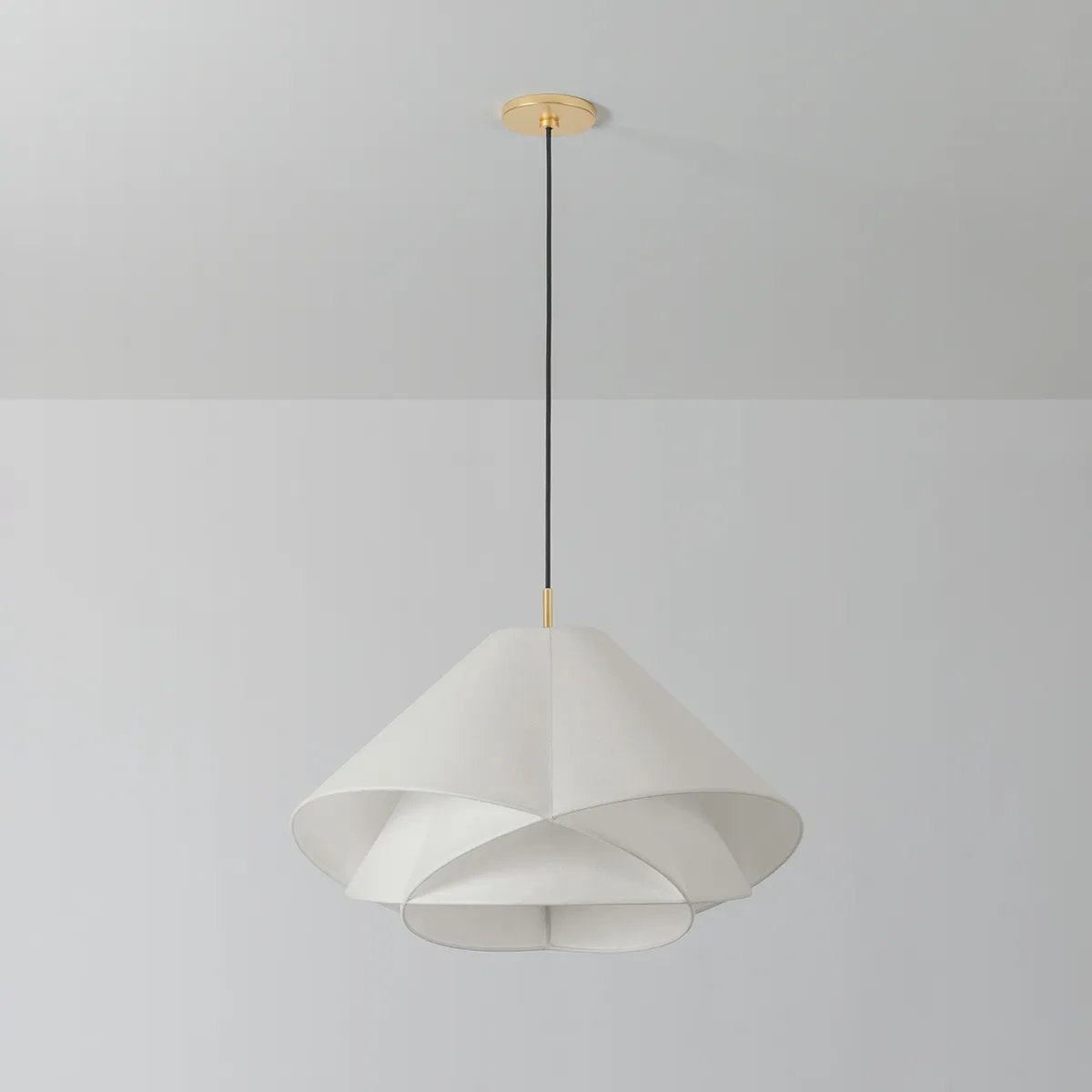 The dynamically layered design of the Edna pendant seeks to push the boundaries of what is possible with a handmade paper shade construction. Constructed as one piece, the shade is comprised of three identical pieces that intersect one another in a perfect geometric array. Amethyst Home provides interior design, new home construction design consulting, vintage area rugs, and lighting in the Houston metro area.