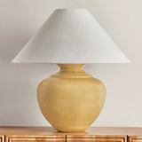 Add a punch of color to your space with the French Ridge table lamp. This ceramic beauty is glazed in a Dijon hue that brings pure sunshine inside. The rounded base is balanced by a sharply tapered conical shade and accented with Aged Brass hardware. It’s a dose of design dopamine for a cozy corner or console Amethyst Home provides interior design, new home construction design consulting, vintage area rugs, and lighting in the Houston metro area.