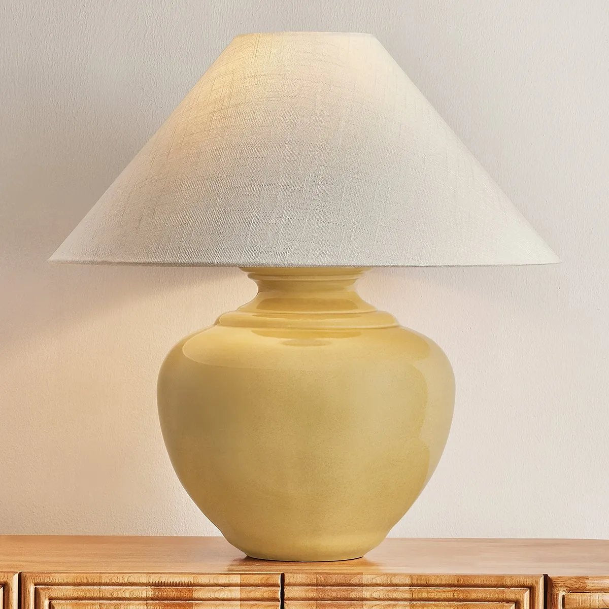 Add a punch of color to your space with the French Ridge table lamp. This ceramic beauty is glazed in a Dijon hue that brings pure sunshine inside. The rounded base is balanced by a sharply tapered conical shade and accented with Aged Brass hardware. It’s a dose of design dopamine for a cozy corner or console Amethyst Home provides interior design, new home construction design consulting, vintage area rugs, and lighting in the Scottsdale metro area.