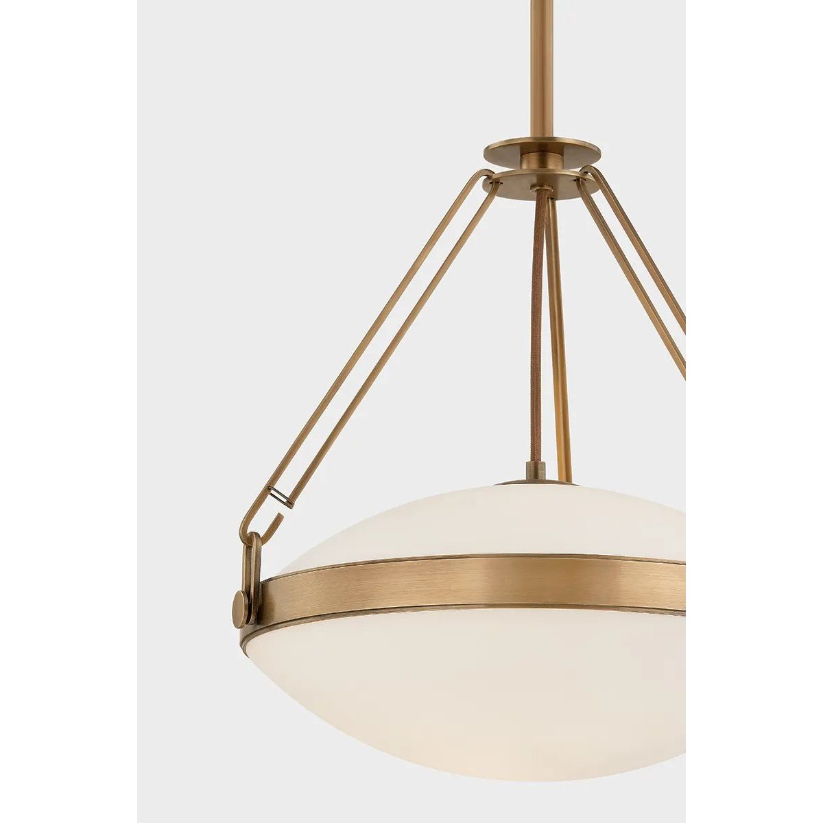 The Kade pendant updates a nostalgic shape with sleek, industrial metalwork and two large opal matte glass shades. Inspired by vintage elements, it features a striking suspension technique with three oversized loops connecting to the central housing above the fixture. The Patina Brass finish adds old-world finesse to the frame. Amethyst Home provides interior design, new home construction design consulting, vintage area rugs, and lighting in the Monterey metro area.