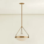 The Kade pendant updates a nostalgic shape with sleek, industrial metalwork and two large opal matte glass shades. Inspired by vintage elements, it features a striking suspension technique with three oversized loops connecting to the central housing above the fixture. The Patina Brass finish adds old-world finesse to the frame. Amethyst Home provides interior design, new home construction design consulting, vintage area rugs, and lighting in the Omaha metro area.