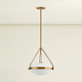 The Kade pendant updates a nostalgic shape with sleek, industrial metalwork and two large opal matte glass shades. Inspired by vintage elements, it features a striking suspension technique with three oversized loops connecting to the central housing above the fixture. The Patina Brass finish adds old-world finesse to the frame. Amethyst Home provides interior design, new home construction design consulting, vintage area rugs, and lighting in the Scottsdale metro area.