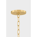 Inspired by the softly layered petals of a coneflower, this whimsical pendant blooms in mid-air to create an airy centerpiece. The natural linen shades of Nadine curl into a staggered, domed array that conceals the inner light source. Elegantly suspended from a refined Aged Brass rod and chain, Nadine is a botanic delight for the modern home.  Amethyst Home provides interior design, new home construction design consulting, vintage area rugs, and lighting in the Scottsdale metro area.