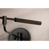 Tailored task lighting, this portable, functional swing arm sconce is also thoughtfully designed and beautiful. The sleek arm features a wooden handle on one end and an adjustable metal shade in Patina Brass or Bronze on the other. The twisted black cord detailing at the shade and backplate give Novel a nostalgic feel. Amethyst Home provides interior design, new home construction design consulting, vintage area rugs, and lighting in the Houston metro area.