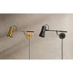 Tailored task lighting, this portable, functional swing arm sconce is also thoughtfully designed and beautiful. The sleek arm features a wooden handle on one end and an adjustable metal shade in Patina Brass or Bronze on the other. The twisted black cord detailing at the shade and backplate give Novel a nostalgic feel. Amethyst Home provides interior design, new home construction design consulting, vintage area rugs, and lighting in the San Diego metro area.