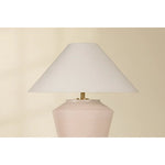 Inspired by raw beauty of the desert, this whitewashed terracotta table lamp is calm and refreshing. The textural body contrasts beautifully with the angular tapered white linen shade. An Aged Brass frame provides a surprising metallic finish. Part of THELIFESTYLEDCO® collection. Amethyst Home provides interior design, new home construction design consulting, vintage area rugs, and lighting in the Boston metro area.