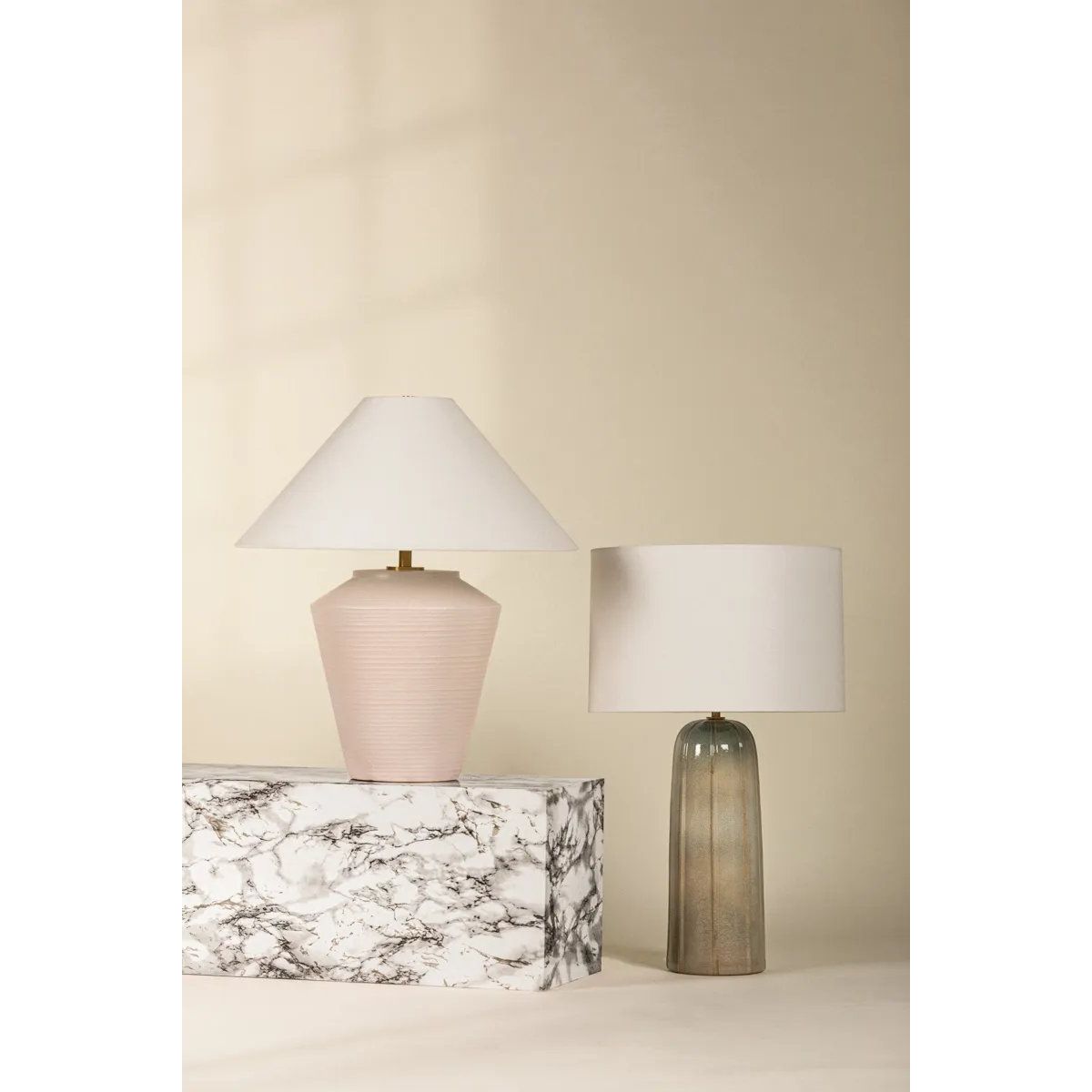 Inspired by raw beauty of the desert, this whitewashed terracotta table lamp is calm and refreshing. The textural body contrasts beautifully with the angular tapered white linen shade. An Aged Brass frame provides a surprising metallic finish. Part of THELIFESTYLEDCO® collection. Amethyst Home provides interior design, new home construction design consulting, vintage area rugs, and lighting in the Winter Garden metro area.
