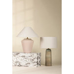 Inspired by raw beauty of the desert, this whitewashed terracotta table lamp is calm and refreshing. The textural body contrasts beautifully with the angular tapered white linen shade. An Aged Brass frame provides a surprising metallic finish. Part of THELIFESTYLEDCO® collection. Amethyst Home provides interior design, new home construction design consulting, vintage area rugs, and lighting in the Winter Garden metro area.
