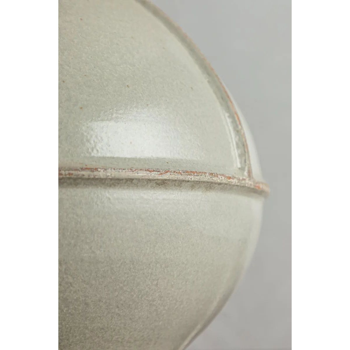 Inspired by rustic pottery, this table lamp's beautifully shaped base is crafted of pale sage ceramic giving it an earthy pale green tone. The off white linen shade pairs naturally and casts a soft glow. Raised seamlines and a reactive glaze that allows hints of the natural ceramic to peek through, give the fixture a hand-thrown, crafted feel. Amethyst Home provides interior design, new home construction design consulting, vintage area rugs, and lighting in the Alpharetta metro area.