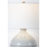 Inspired by rustic pottery, this table lamp's beautifully shaped base is crafted of pale sage ceramic giving it an earthy pale green tone. The off white linen shade pairs naturally and casts a soft glow. Raised seamlines and a reactive glaze that allows hints of the natural ceramic to peek through, give the fixture a hand-thrown, crafted feel. Amethyst Home provides interior design, new home construction design consulting, vintage area rugs, and lighting in the Omaha metro area.