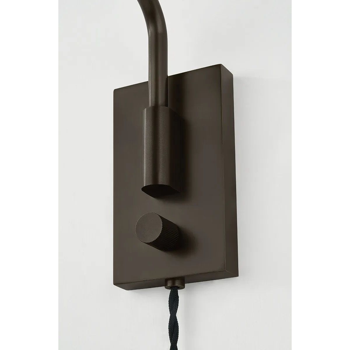 The Yvette plug-in sconce uses a modern lens to reimagine vintage design motifs. The geometry of the metalwork has been simplified to basic lines and curves, with the arc-shaped piece above the shade serving as a handle for adjustments. Finished in creamy Soft Bisque, this design-forward sconce adds plenty of directional light to a desk or bedside. Amethyst Home provides interior design, new home construction design consulting, vintage area rugs, and lighting in the Scottsdale metro area.