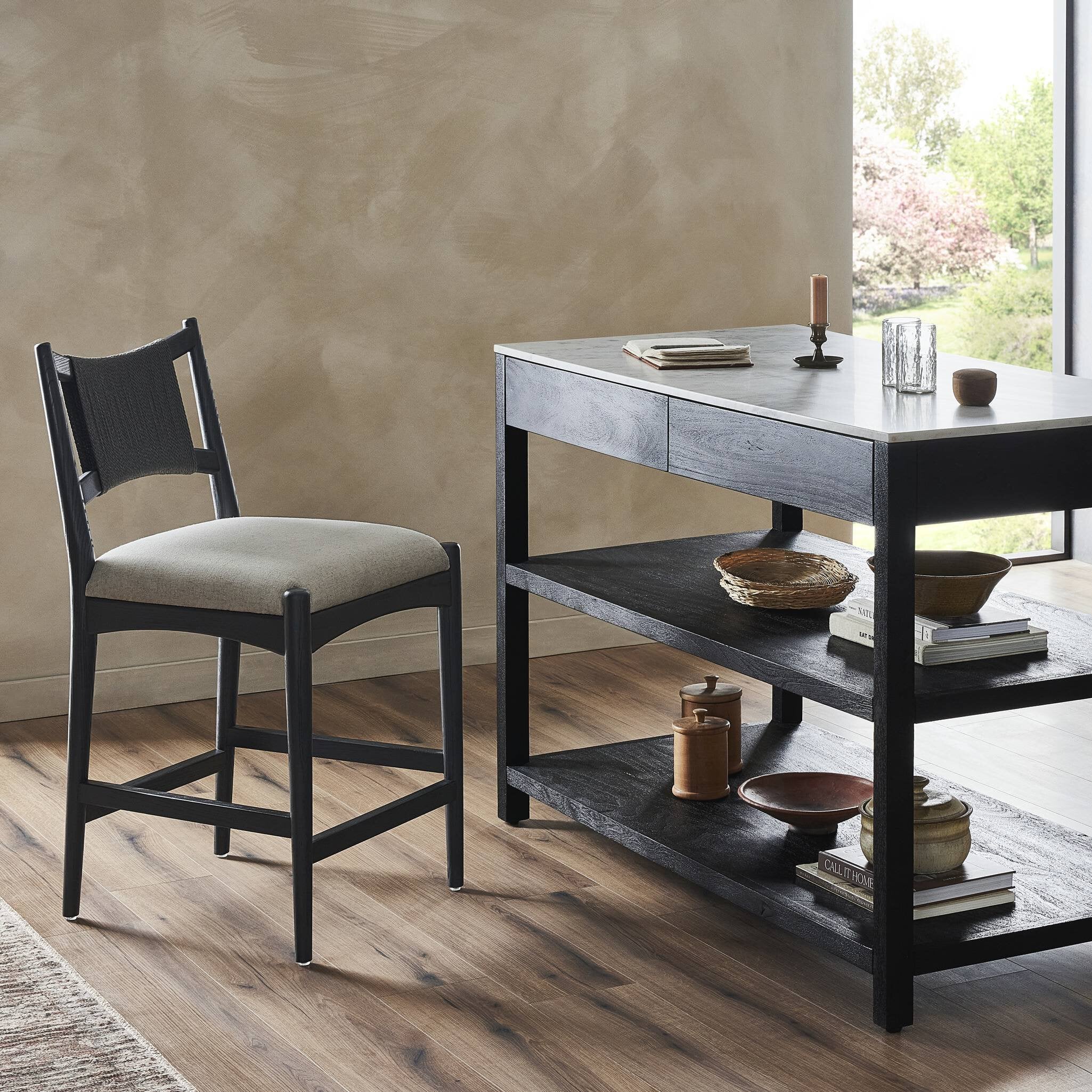 Featuring Haddon Antwerp Natural Counter Stool by Four Hands at Amethyst Home. A curved back wrapped and textural woven paper cord take this everyday counter stool to new heights. Black-finished parawood frames a linen-blend seat for a clean look with contrast.Overall Dimensions: 19.75"w x 23.25"d x 39.25"hWeight : 19.51 lbsMaterials : 39% Linen, 35% Cotton, 26% Polyester, Solid Nett. Amethyst Home provides interior design, new construction, custom furniture, and area rugs in the Boston metro area