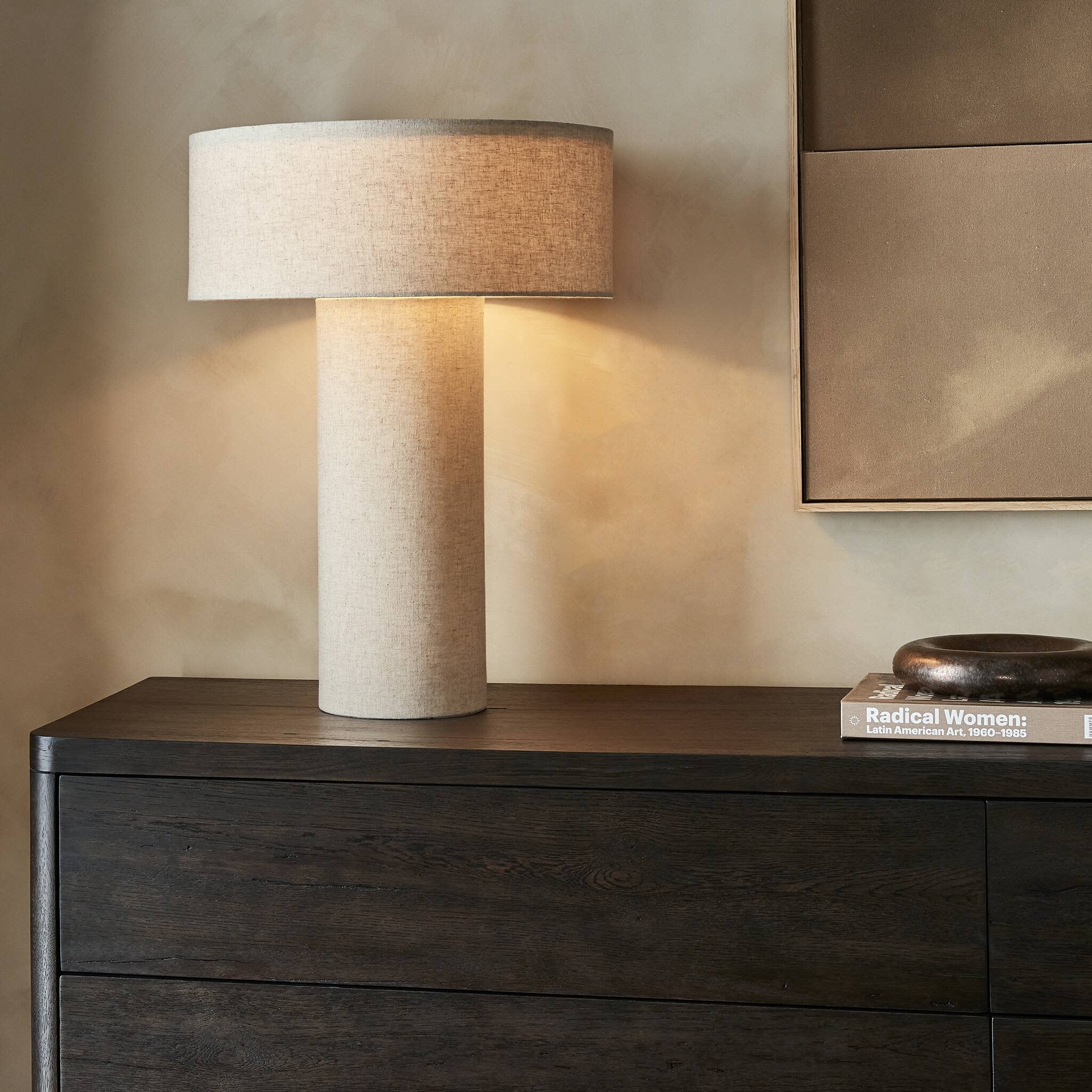 Featuring Hensley Antique Brass Iron Table Lamp by Four Hands at Amethyst Home. Monochrome material. Flax linen covers a classic cylindrical base, topped with a round, low drum-style shade — a modern shape and play on proportions. Brass rotary and finial detail on top break up the all-linen look.Overall Dimensions: 18.00"w x 18.00"d x 24.50"hWeight : 8.16 lbsMaterials : Iron, 75% F. Amethyst Home provides interior design, new construction, custom furniture, and area rugs in the Portland metro area