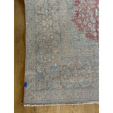 Whitewashed pastels hues on one side, flip for intense pinks and blues!  Hand knotted, 100% wool - perfect for high traffic areas.