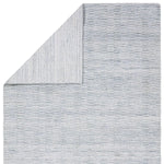 Made from 100% PET the indoor/ outdoor handwoven Roan Aaren is perfect for performance needs.  This pseudo-solid blue rug bodes a light checkered appearance with a neutral backdrop.ROA0 Amethyst Home provides interior design, new home construction design consulting, vintage area rugs, and lighting in the Boston metro area.