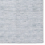 Made from 100% PET the indoor/ outdoor handwoven Roan Aaren is perfect for performance needs.  This pseudo-solid blue rug bodes a light checkered appearance with a neutral backdrop.ROA0 Amethyst Home provides interior design, new home construction design consulting, vintage area rugs, and lighting in the Dallas metro area.