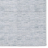 Made from 100% PET the indoor/ outdoor handwoven Roan Aaren is perfect for performance needs.  This pseudo-solid blue rug bodes a light checkered appearance with a neutral backdrop.ROA0 Amethyst Home provides interior design, new home construction design consulting, vintage area rugs, and lighting in the Dallas metro area.