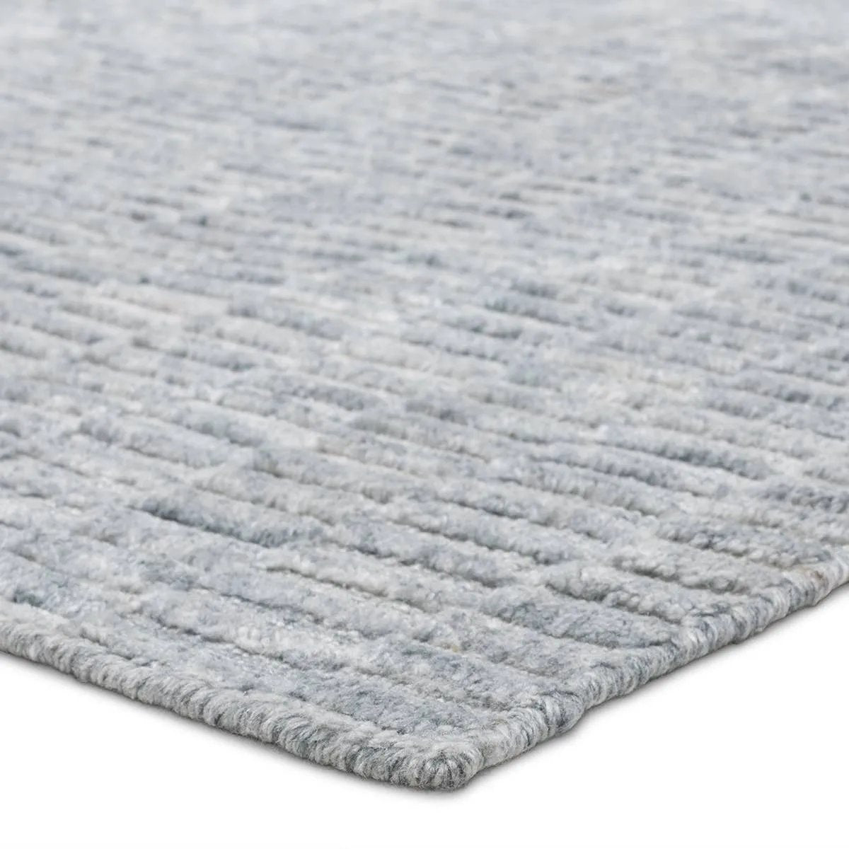Made from 100% PET the indoor/ outdoor handwoven Roan Aaren is perfect for performance needs.  This pseudo-solid blue rug bodes a light checkered appearance with a neutral backdrop.ROA0 Amethyst Home provides interior design, new home construction design consulting, vintage area rugs, and lighting in the Newport Beach metro area.