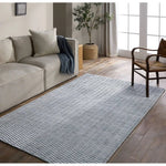 Made from 100% PET the indoor/ outdoor handwoven Roan Aaren is perfect for performance needs.  This pseudo-solid blue rug bodes a light checkered appearance with a neutral backdrop.ROA0 Amethyst Home provides interior design, new home construction design consulting, vintage area rugs, and lighting in the Salt Lake City metro area.