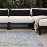Made from 100% PET the indoor/ outdoor handwoven Roan Aaren is perfect for performance needs.  This pseudo-solid blue rug bodes a light checkered appearance with a neutral backdrop.ROA0 Amethyst Home provides interior design, new home construction design consulting, vintage area rugs, and lighting in the Tampa metro area.