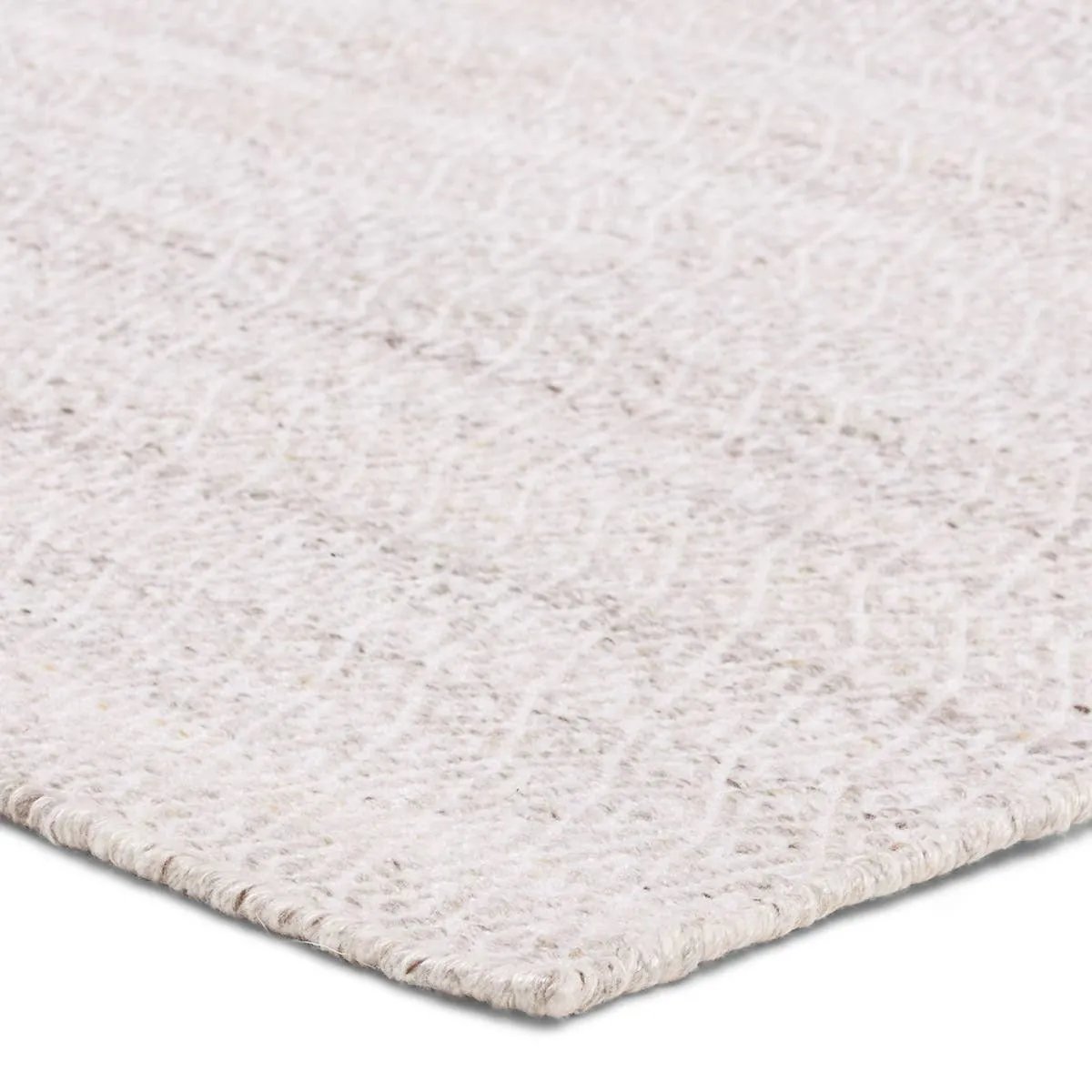 Handwoven of weather-resistant PET, the Almas Imogen delights with contemporary colorways and designs. The Imogen design showcases a diamond trellis pattern in a colorway of gray and white. The variegated neutral hues provide a subtle distressed look that wears well over time. Amethyst Home provides interior design, new home construction design consulting, vintage area rugs, and lighting in the Austin metro area.