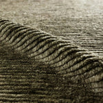 Drawing inspiration from Moroccan textiles, Alpine showcases the beauty in simplicity. Durable wool is hand-knotted onto a cotton foundation to create this high-piled accent piece. Its solid green design instantly adds warmth and comfort to any indoor, medium-traffic setting.Hand Knotte Amethyst Home provides interior design, new home construction design consulting, vintage area rugs, and lighting in the Charlotte metro area.
