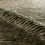 Drawing inspiration from Moroccan textiles, Alpine showcases the beauty in simplicity. Durable wool is hand-knotted onto a cotton foundation to create this high-piled accent piece. Its solid green design instantly adds warmth and comfort to any indoor, medium-traffic setting.Hand Knotte Amethyst Home provides interior design, new home construction design consulting, vintage area rugs, and lighting in the Charlotte metro area.