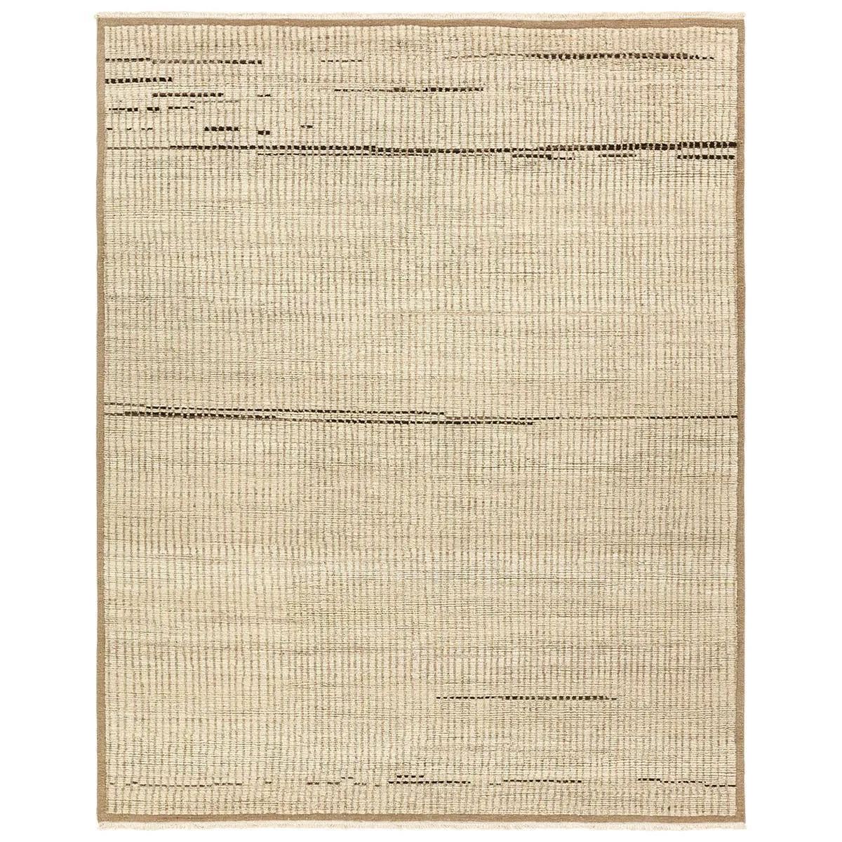 Full of texture, the handknotted Kazben Andar stuns with modern Moroccan patterns in natural hues. The Andar design delights with a taupe, tan, and brown linear pattern. A thin border adds the finishing touches to this elevated accent piece. Low, ribbed pile creates visual intrigue and grounds any contemporary space. Amethyst Home provides interior design, new home construction design consulting, vintage area rugs, and lighting in the Nashville metro area.