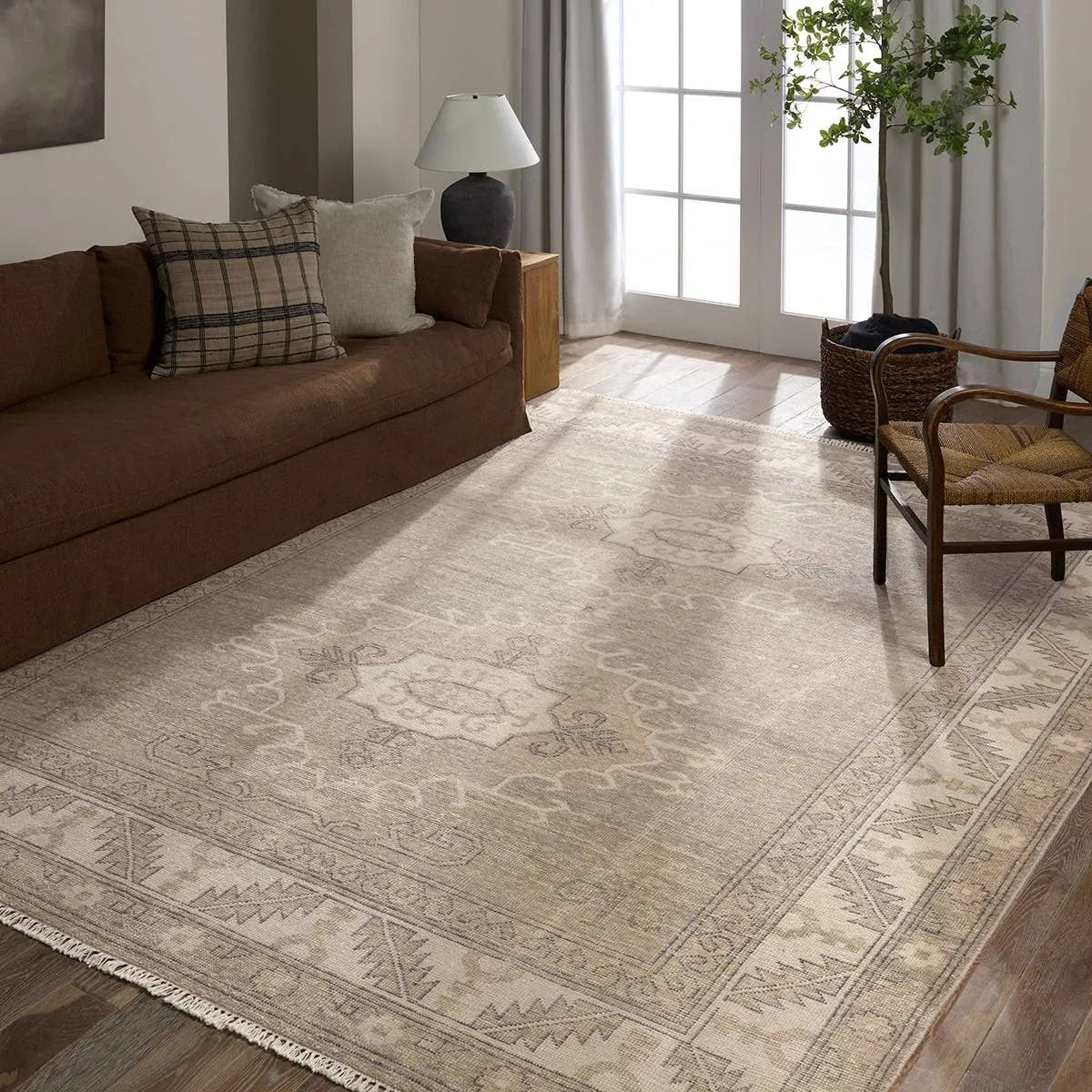 Featuring Apollo Famille Hand-Knotted Rug by Jaipur Living at Amethyst Home. An updated take on traditional design, the Apollo Famille is hand knotted of 100% wool by artisans in India for a luxurious, high-quality design.  The Famillie design features two classic medallions adorned with Elibelinde motifs with a distinct border honoring the Garden of Eden.Hand. Amethyst Home provides interior design, new home construction design consulting, vintage area rugs, and lighting in the Dallas metro area.