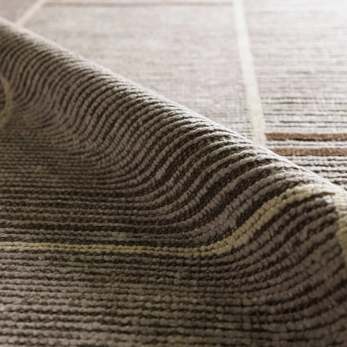 Beauty is on the horizon with the Bezem Aytana. The Aytana design features a mid-century linear pattern for subtle visual depth. Hand-knotted from easy-care wool with a high-low pile, this piece is as practical as it is captivating—a true testament to modern craftsmanship.Hand Knotte Amethyst Home provides interior design, new home construction design consulting, vintage area rugs, and lighting in the Houston metro area.