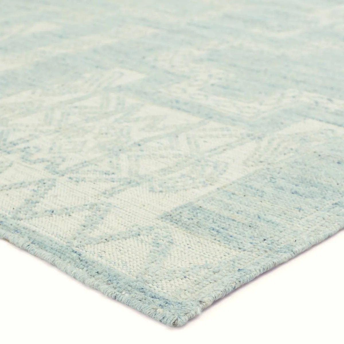 Traditional African textiles inspired the hand-knotted Monarch Cirus. This captivating assortment of wool rugs features updated colorways and distinctive geometric details perfect for both transitional and globally influenced spaces. The Cirus area rug delights with an intricate pattern in a sky gray and ivory colorway with flecks of blue. Amethyst Home provides interior design, new home construction design consulting, vintage area rugs, and lighting in the Tampa metro area.