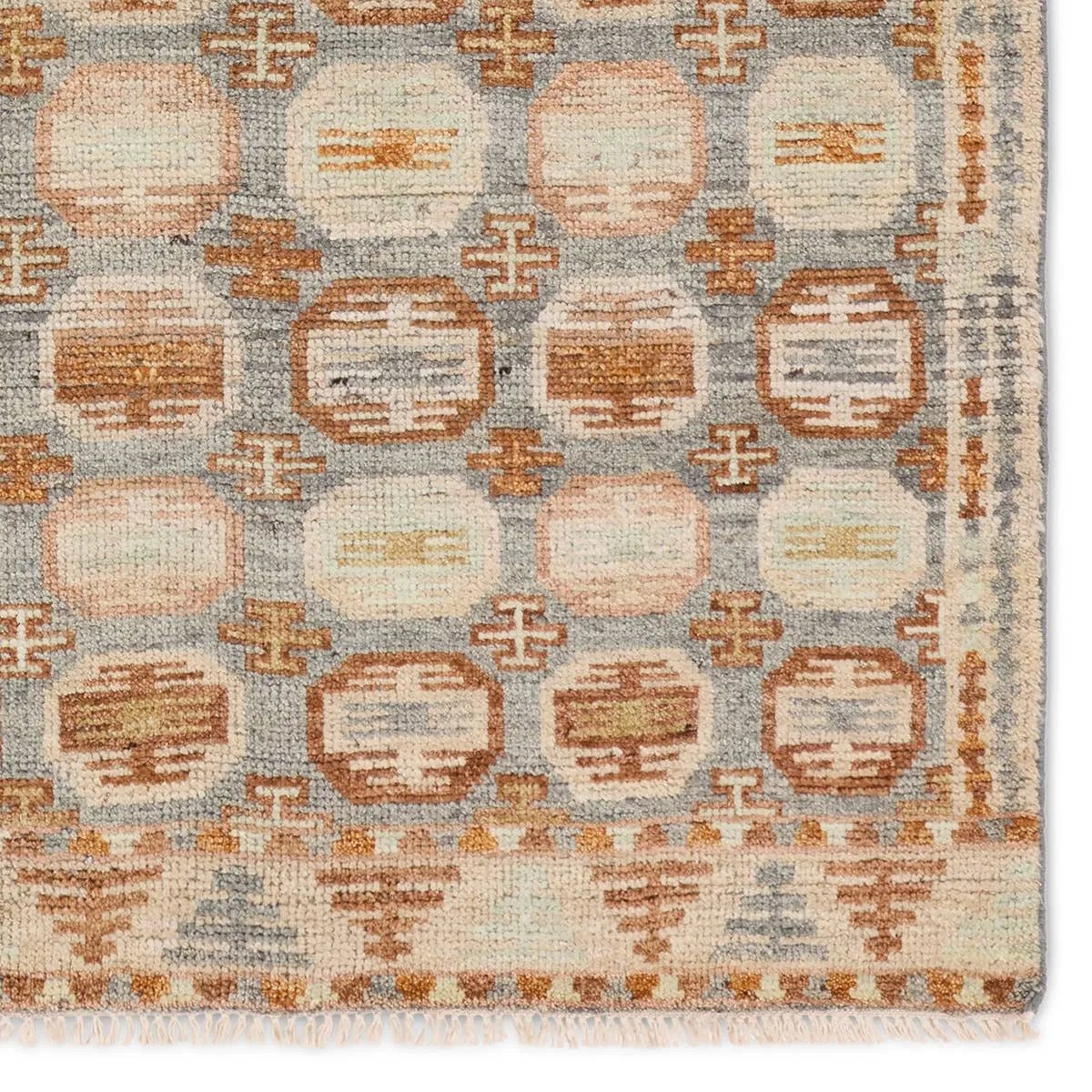Featuring Hazan Titale Hand-Knotted Rug by Jaipur Living at Amethyst Home. The Turkish-Killum-inspired Hazan Titale is intricately handknotted by artisans in India. Crafted with 15 knots per square inch, these durable area rugs thrive in both high and low traffic areas of the home. The Titale design showcases traditional-style miniature medallions in orange, s. Amethyst Home provides interior design, new home construction design consulting, vintage area rugs, and lighting in the Dallas metro area.