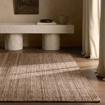 Subtle variations of brown create depth and dimension in the elegantly understated Hue rug. Handwoven with precision, its solid design offers a timeless foundation for any space—from modern to classic interiors.Handwove Amethyst Home provides interior design, new home construction design consulting, vintage area rugs, and lighting in the Charlotte metro area.