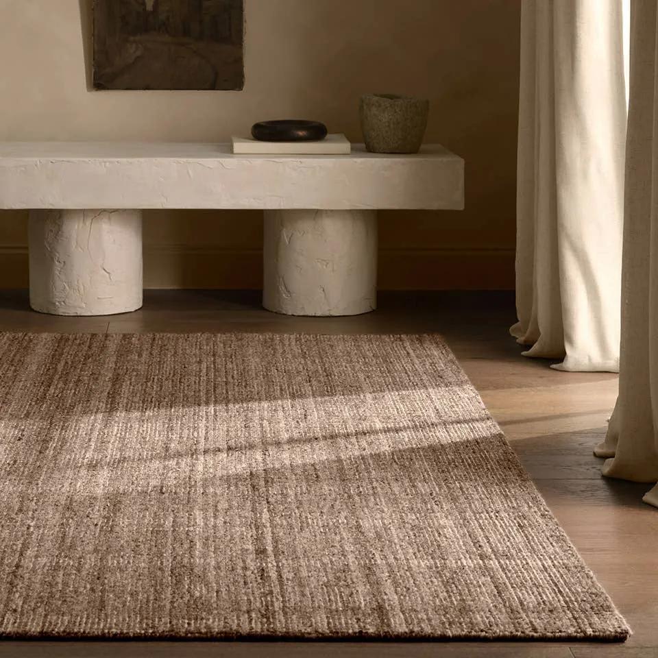Subtle variations of brown create depth and dimension in the elegantly understated Hue rug. Handwoven with precision, its solid design offers a timeless foundation for any space—from modern to classic interiors.Handwove Amethyst Home provides interior design, new home construction design consulting, vintage area rugs, and lighting in the Charlotte metro area.
