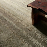 A contemporary interplay of cream and green comes to life in a striking abstract linear design. Crafted from a luxurious blend of viscose and silk, the Jovian design’s luminous sheen accentuates the depth and movement of its pattern. This handknotted piece exudes sophistication and exceptional craftsmanship, making it a stunning foundation.HIB0 Amethyst Home provides interior design, new home construction design consulting, vintage area rugs, and lighting in the Alpharetta metro area.