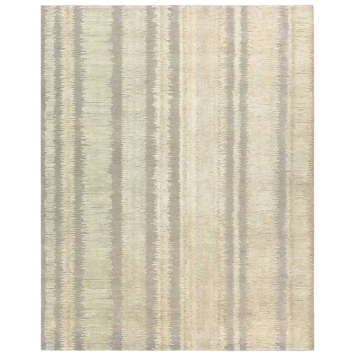 A contemporary interplay of cream and green comes to life in a striking abstract linear design. Crafted from a luxurious blend of viscose and silk, the Jovian design’s luminous sheen accentuates the depth and movement of its pattern. This handknotted piece exudes sophistication and exceptional craftsmanship, making it a stunning foundation.HIB0 Amethyst Home provides interior design, new home construction design consulting, vintage area rugs, and lighting in the Boston metro area.