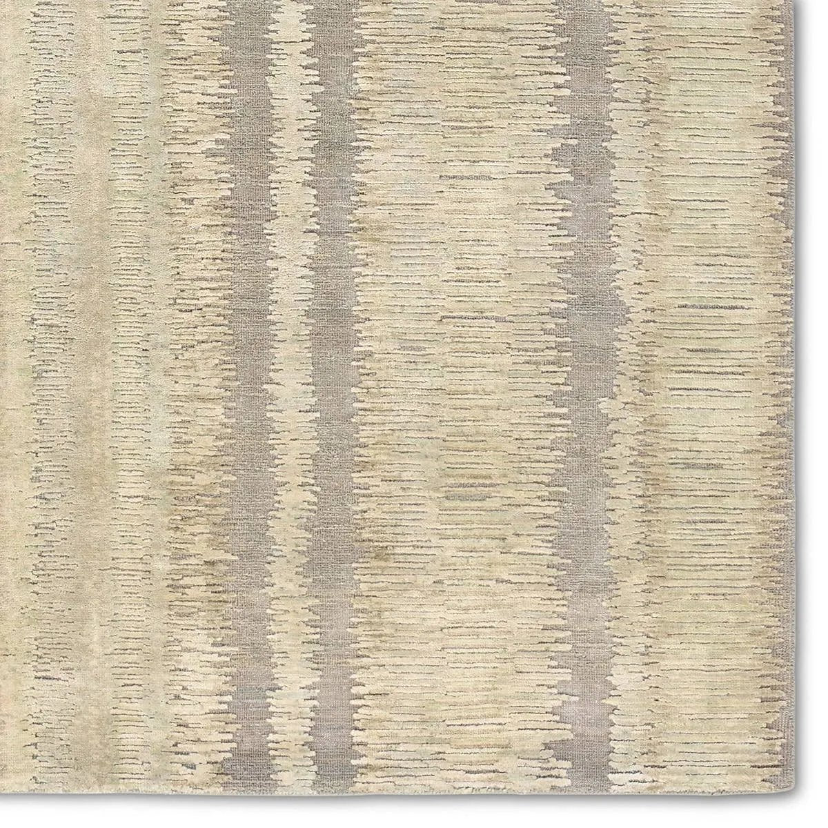 A contemporary interplay of cream and green comes to life in a striking abstract linear design. Crafted from a luxurious blend of viscose and silk, the Jovian design’s luminous sheen accentuates the depth and movement of its pattern. This handknotted piece exudes sophistication and exceptional craftsmanship, making it a stunning foundation.HIB0 Amethyst Home provides interior design, new home construction design consulting, vintage area rugs, and lighting in the Los Angeles metro area.
