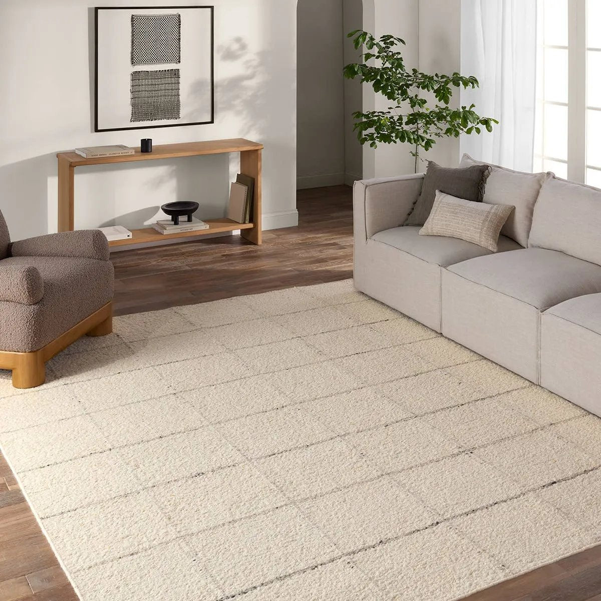Featuring Leona Coart Rug by Jaipur Living at Amethyst Home. With its lofty, handmade loops, the Coart rug is an inviting, textural essential. Crafted of 100% undyed wool, its natural, relaxed, persona is met with a crisp, contemporary grid pattern.  An outstanding union of artistry and contemporary style, its physical approachability, monochromatic pale. Amethyst Home provides interior design, new home construction design consulting, vintage area rugs, and lighting in the Laguna Beach metro area.