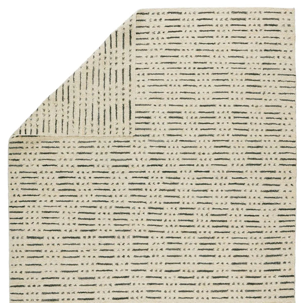 The texture-rich Leona Elver offers an assortment of updated kilim looks, re-invented with the on-trend shearling style and neutral, modern palettes. The handwoven Elver rug features a globally inspired, gray dot and ticking line pattern on a neutral tan base. Amethyst Home provides interior design, new home construction design consulting, vintage area rugs, and lighting in the Houston metro area.