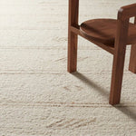 The texture-rich Leona Essek offers an assortment of updated kilim looks, re-invented with the on-trend shearling style and neutral, modern palettes. The handwoven Essek rug features a globally inspired, light brown, stripe and tribal pattern on a neutral cream base. Amethyst Home provides interior design, new home construction design consulting, vintage area rugs, and lighting in the Portland metro area.