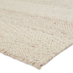 Featuring Leona  Klarna Rug by Jaipur Living at Amethyst Home. The texture-rich Leona Klarna offers an assortment of updated kilim looks, re-invented with the on-trend shearling style and neutral, modern palettes. The handwoven Klarna rug features a globally inspired, light brown, stripe pattern on a neutral cream base. This 100% wool accent piece delights. Amethyst Home provides interior design, new home construction design consulting, vintage area rugs, and lighting in the Alpharetta metro area.